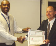 Rolf Köstlin receiving his certificate from Vaal branch chairman Solly Mabitsela.